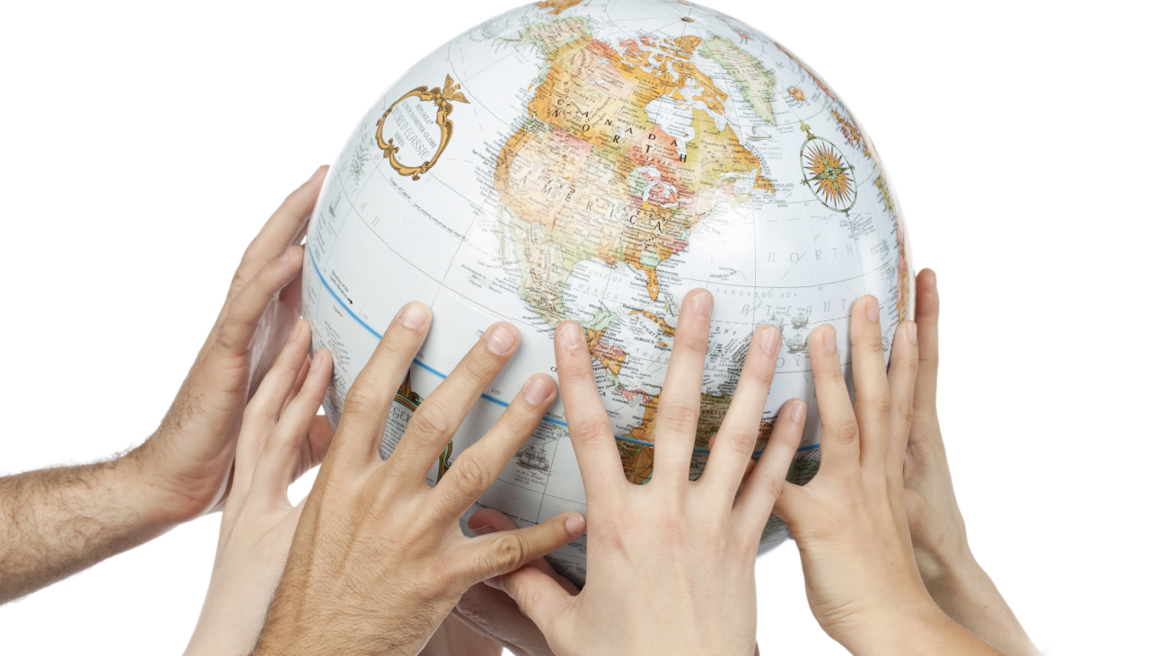 Close-up image of a group of people's hand holding the globe over the white background
