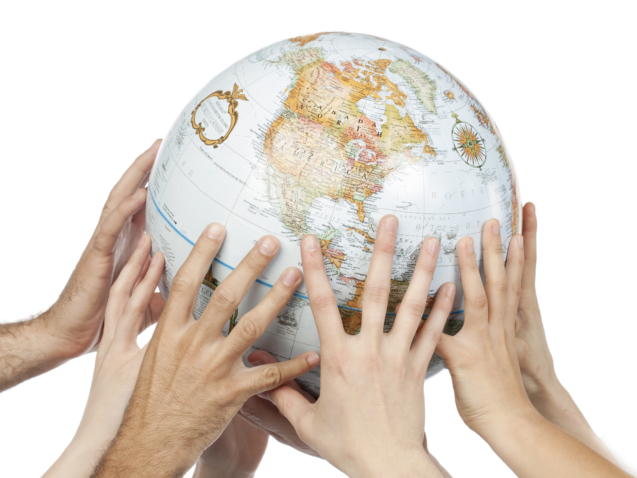Close-up image of a group of people's hand holding the globe over the white background