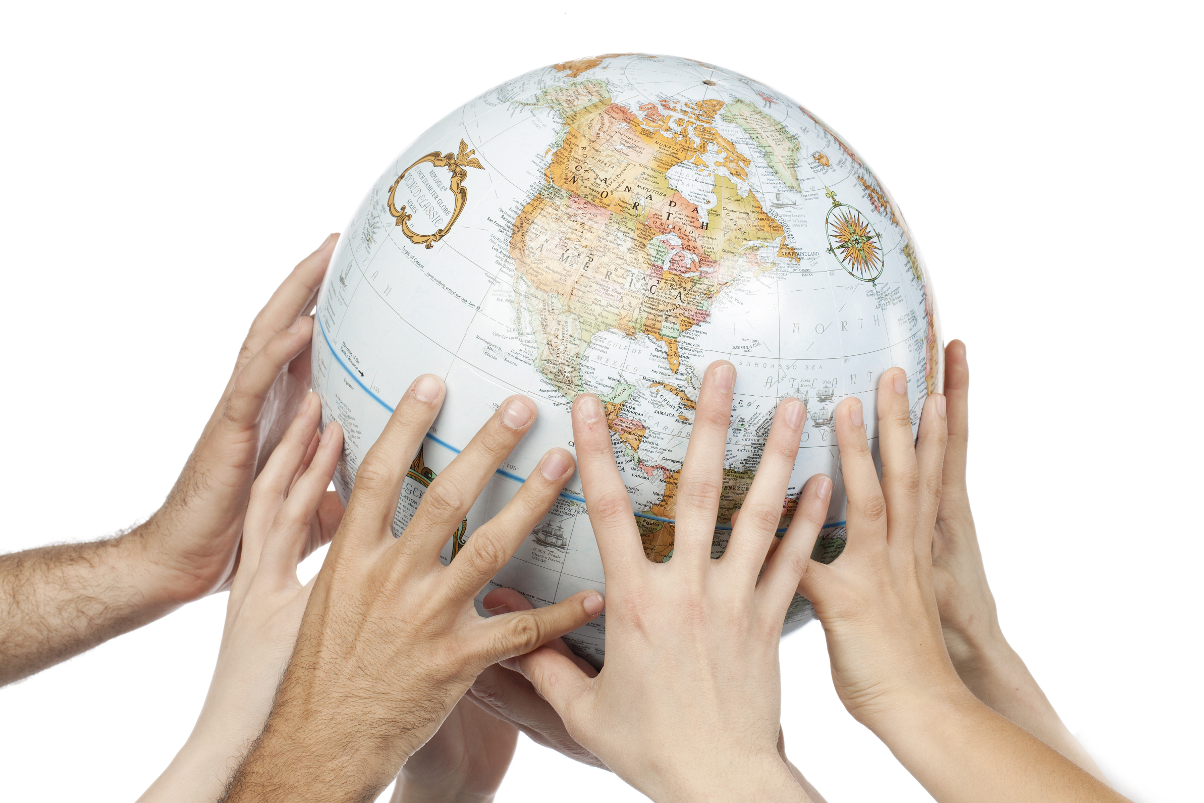 Close-up image of a group of people's hand holding the globe over the white background